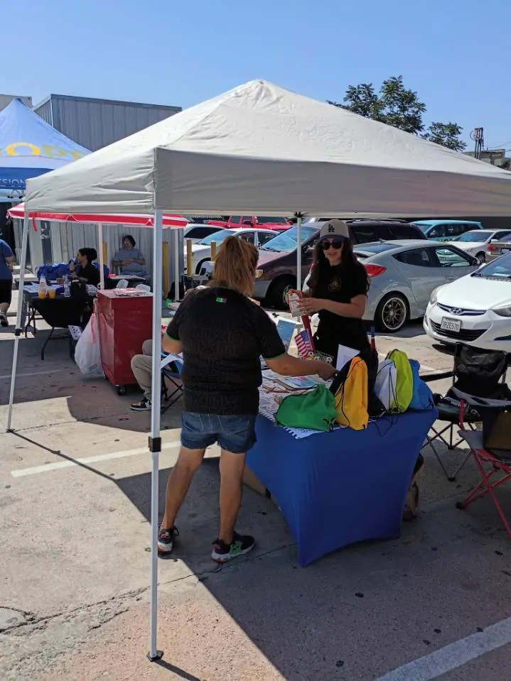 HLAT volunteers at a resource fair table